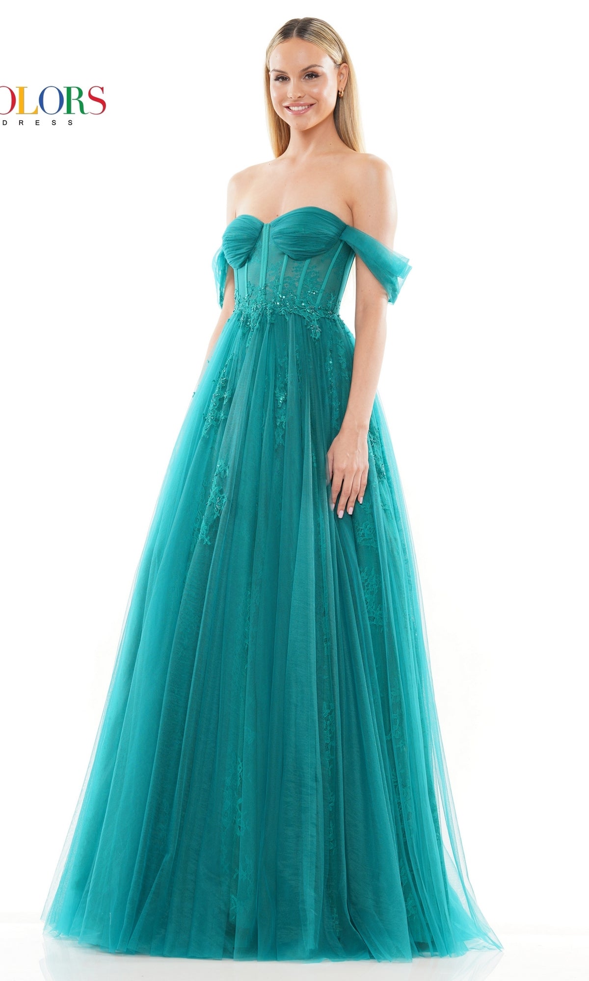 A woman in the Long Sweetheart Prom Ball Gown: Colors Dress 3240, featuring a teal off-the-shoulder sweetheart neckline and flowing A-line skirt, stands against a plain white background.